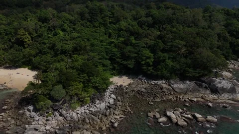 Aerial Pull Back From Rocky Shore Over Rainforest Headland, Laem Sing Video stock 347989710