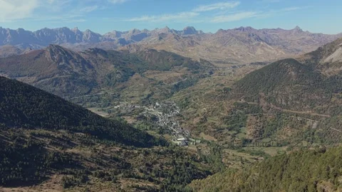 Aerial Pull Back from Sallent de Gallego and Pyrenean Valley Stock Footage 346642426