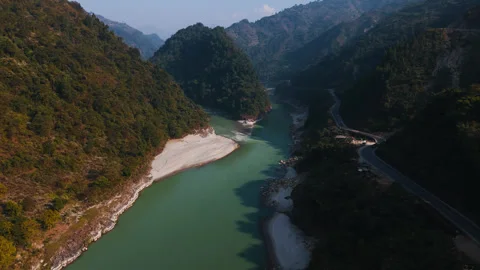 Aerial pull back shot along Trishuli River valley near Pokhara in Nepal, 4k Stock Footage 346468126