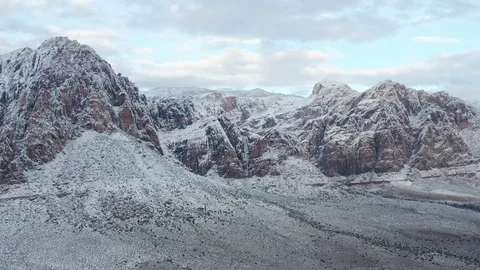Aerial pull back shot of colorful desert mountains, peaks at Red Rock Canyon Stock Footage 122053772