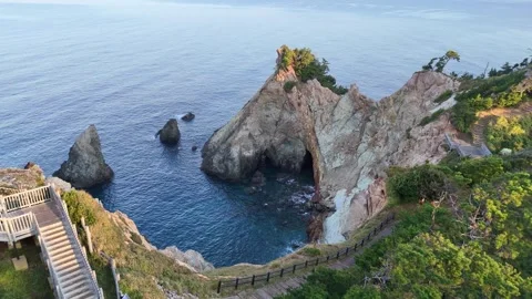 Aerial pull back shot from Koganezaki cliffs to the parking lot│4K Stock Footage 326081879