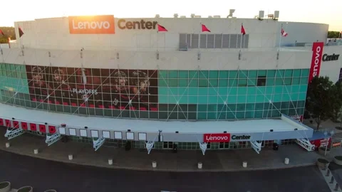 Aerial Pull Back Shot of Lenovo Center Arena Facade at Sunset in Raleigh NC Stock Footage 335335330