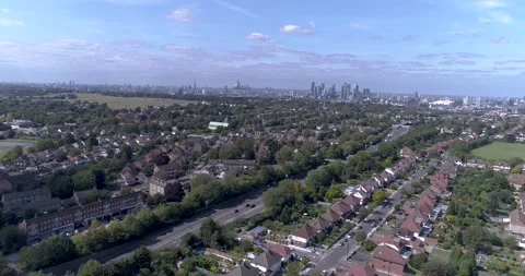 Aerial pull back shot of London Skyline above suburbs Stock Footage 149717741