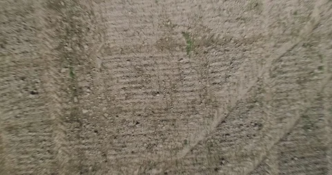 Aerial pull back shot looking down on freshly prepared field on large farm Stock-Footage 104064171