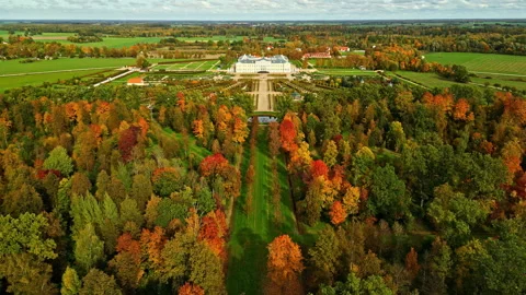 Aerial pull back shot of Rundale Palace Museum with french garden during autumn Stock Footage 297726891