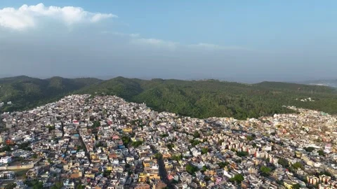 Aerial Pull-Back Shot Tilting Down on Overpopulated City Infrastructure Stock-Footage 335989421