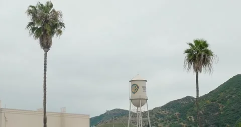 Aerial pull-back shot of Warner Brothers WB Water Tower on Studio Lot Stock-Footage 242862652