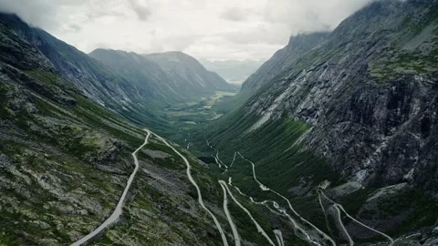 Aerial Pull Back: Trollstigen Mountain Road and Isterdalen Valley, Norway Stock Footage 330040721