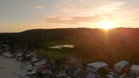 Aerial Pull Back of Tropical Island Beach Sunset Stock Footage