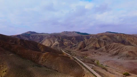 Aerial pull back view of Calanchi del Cannizzola in the East part of Sicily Stock Footage 306240945