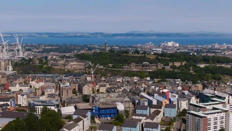 Aerial pull back view of Calton hill in Edinburgh and the firth of forth Stock Footage 116542318