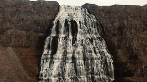 Aerial pull back view of Dynjandi waterfall in Iceland at sunset Stock Footage 116184431
