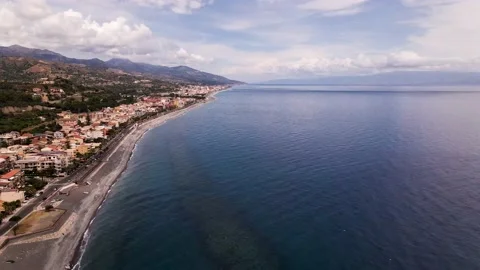 Aerial pull back view of the East coast of Sicily Stock Footage 139291672