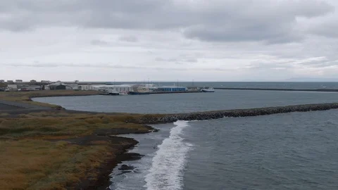 Aerial pull back view of a fishing ship wreck on a beach in West Iceland Stock Footage 117348785