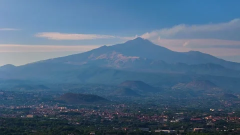 Aerial pull-back view of Mount Etna in Sicily with smoke from the crater Stock Footage 289826148