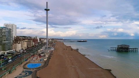 Aerial pull back view of the seafront and the beach in Brighton (hyper lapse) Stock Footage 106398052
