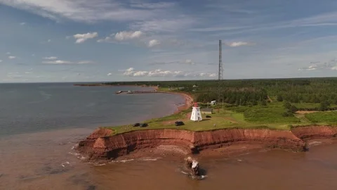 Aerial Pull Back Wide Shot of Cape Egmont Lighthouse, PEI Coast Stock Footage 341363165