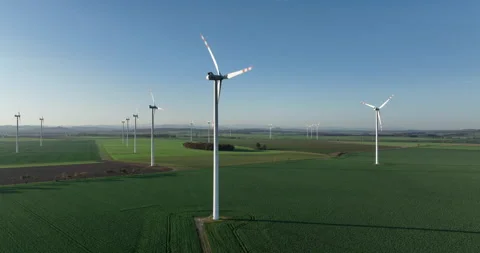 Aerial pull back from wind farm in Lower Silesia on autumn morning Stock Footage 346609433