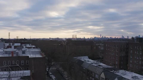 Aerial pull in drone footage of New York skyline before sunset on a cloudy day Stock Footage 260355157