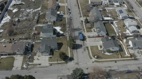 Aerial pull fly over of Garbage Truck Driving down Rural Neighborhood Stock-Footage 116198454