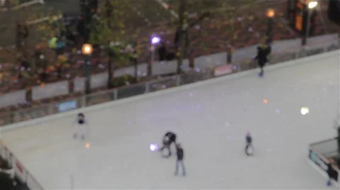 Aerial Pull Focus of Children Revellers and People Enjoying Ice Skating on Rink Stock-Footage 44524272
