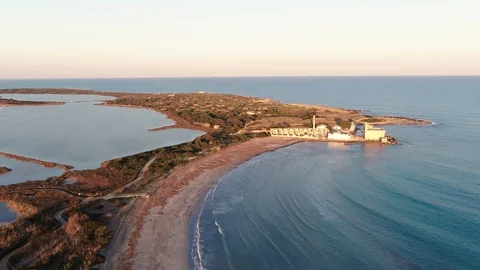 Aerial pull out descending view of the nature reserve of Vendicari, Sicily Stock Footage 104599603