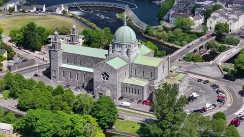 Aerial pull out from Galway Cathedral on Corrib river, West Coast of Ireland Stock Footage 310596188