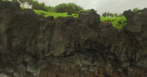 Aerial Pull Out Jib Up Rocks to Jungle Video stock 75130876