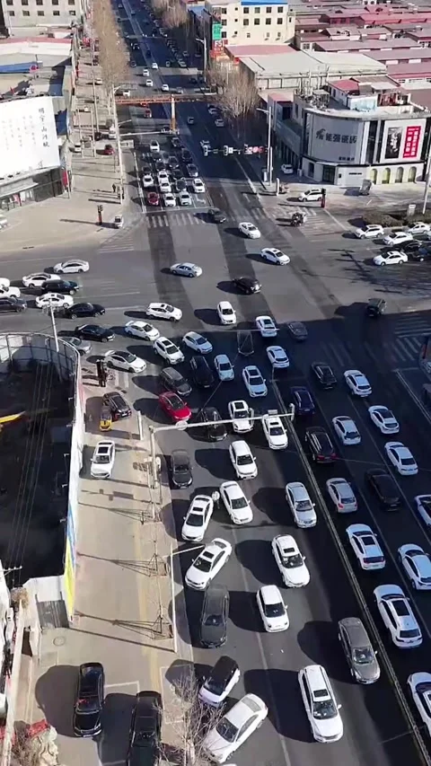 Aerial Pull-out Shot of Busy Urban Intersection and Street in China Stock Footage 330100053