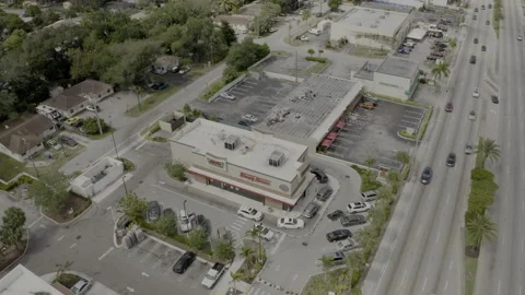 Aerial pull out shot Krispy Kreme donut shop Miami FL Stock Footage 152115659