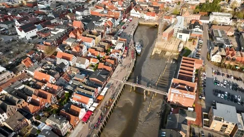 Aerial pull-out shot with tilt-up moving of Husum. Stock-Footage 332227462