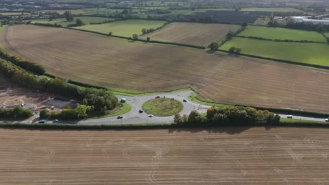 Aerial Pull Out Shot of UK Roundabout in Countryside 4K 25 Stock Footage 301128741