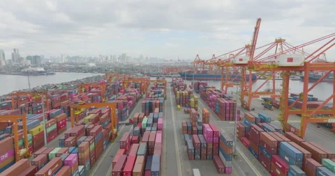 Aerial Pull Out Shot of Various Shipping Containers And Large Gantry Cranes Stock Footage 333290519
