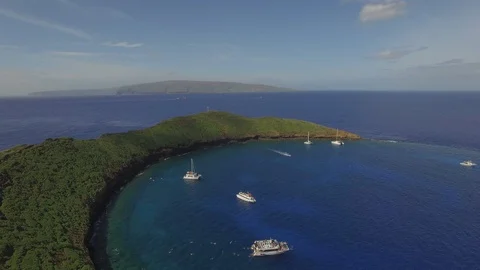 Aerial Pull Out SIdeview  of Molokini Crater Kahoolawe Island In Background. Stock Footage 95768989