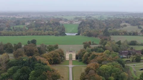 Aerial Pull Out of Stowe Arch and House in Autumn 4K 25 Stock Footage 301190930