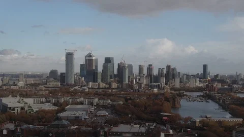 Aerial pull out view of the financial district of the Docklands in London Stock Footage 101436646