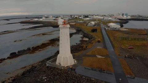 Aerial pull out view of a lighthouse in Akranes in West Iceland Stock Footage 117351139
