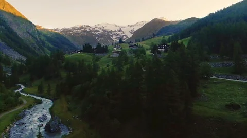 Aerial pull out view of Monte Rosa in the Italian Alps at sunrise Stock Footage 113334748