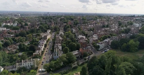 Aerial pull out view of a residential Victorian village in North London Stock Footage 78875462