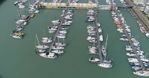 Aerial pull out view of sailing boats in a marina in Brighton, Southern England Stock Footage 80415807