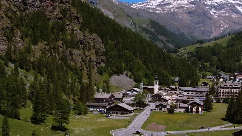 Aerial pull out view of the sky resort village of Gressoney in the Italian Alps Stock Footage 112006960