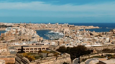 Aerial pull out view of the towns of Vittoriosa and Valletta in Malta Stock Footage 109257631
