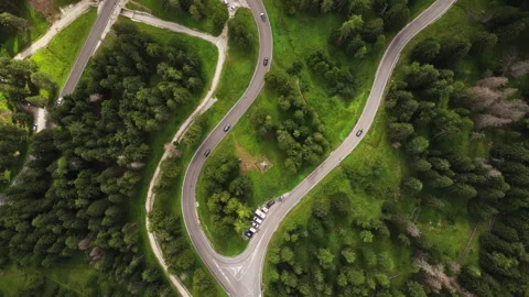Aerial Pull Out View of Winding Mountain Road and Traffic in Misurina Dolomites Stock Footage 346774237