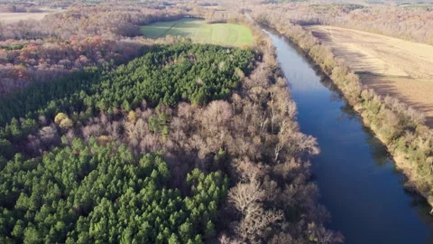 Aerial pull over the calm Yadkin River Stock Footage 295651938