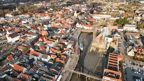Aerial pull-in shot moving towards of Husum. Stock-Footage 331788484