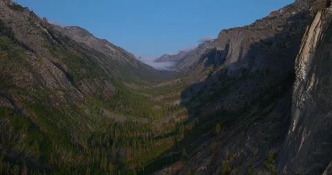 Aerial Pullback Along Blodgett Canyon Montana with Steep Rock Walls Stock Footage 331922507