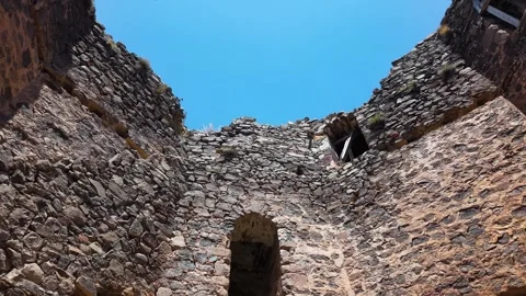 Aerial Pullback from Ancient Fortress Tower Revealing Vast Plains Stock Footage 339603336