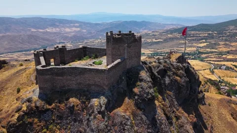 Aerial Pullback from Ancient Fortress Tower Revealing Vast Plains Stock Footage 339606566