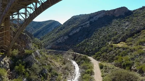 Aerial pullback of an arched bridge with traffic Stock Footage 71873163