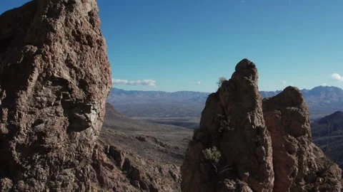Aerial pullback between towering rock pinnacles Stock Footage 260321874